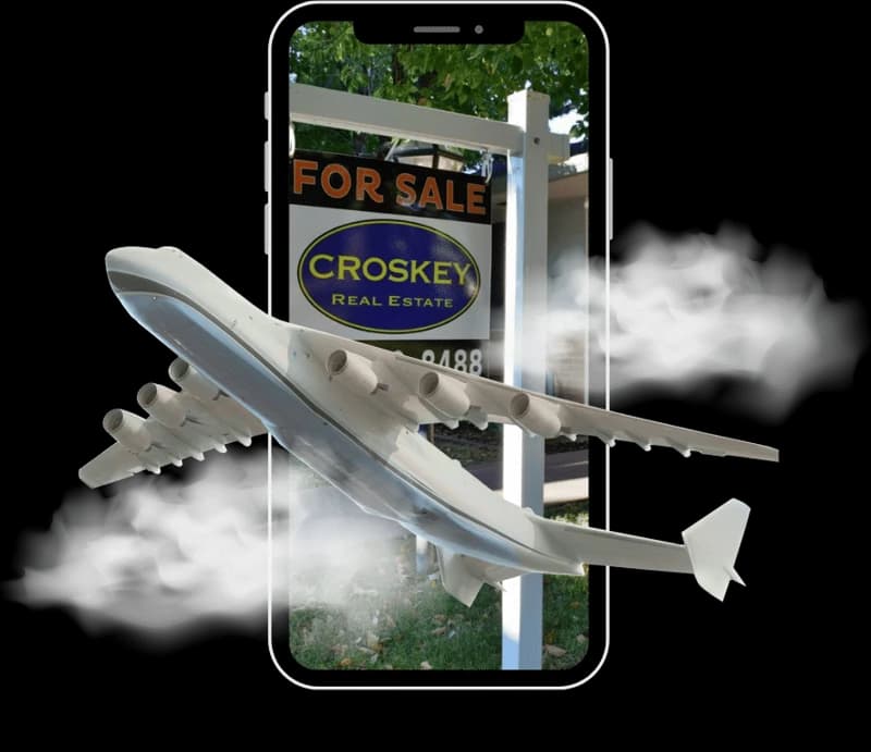 Plane flying out of a phone showing a Croskey For Sale sign